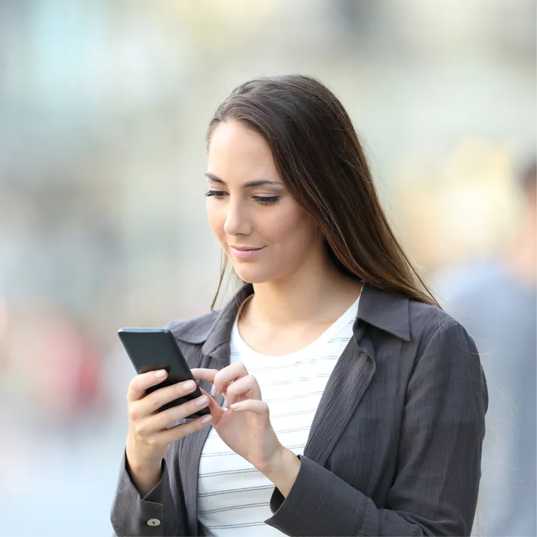 A woman looking at her phone
